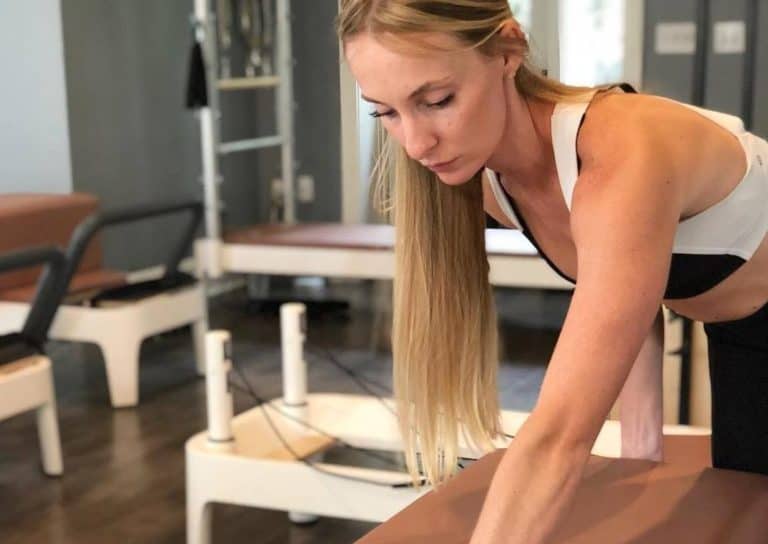 Focused Pilates exercise class at Charleston studio for core strength and flexibility.