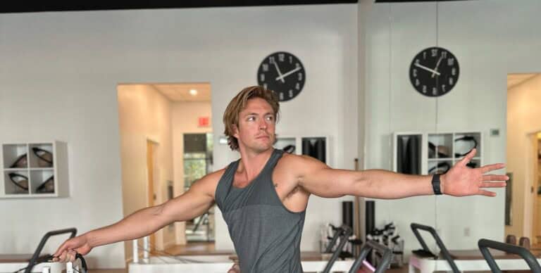 Pilates instructor practicing at Charleston Pilates studio, focusing on core strength and flexibility.