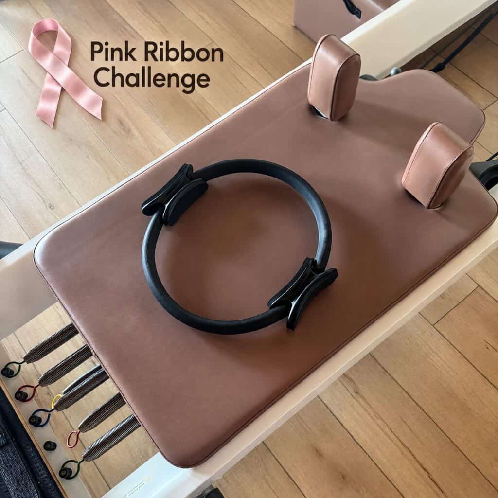 Pink Ribbon Challenge: pink breast cancer awareness ribbon beside a reformer at Pilates of Charleston
